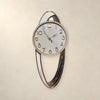 Compas Modern Abstract Oval Pendulum-Style Wall Clock – Metallic Statement Decor